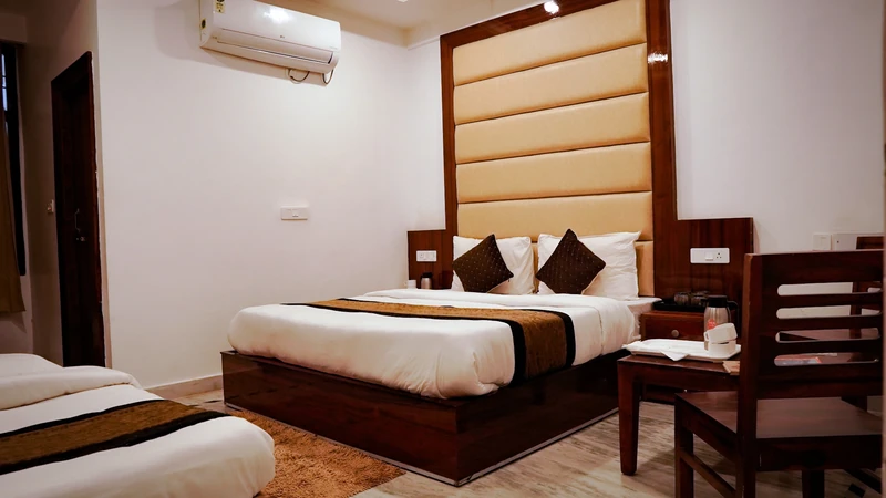 Premium Room seating area with coffee table, two chairs and 50-inch 4K Smart TV